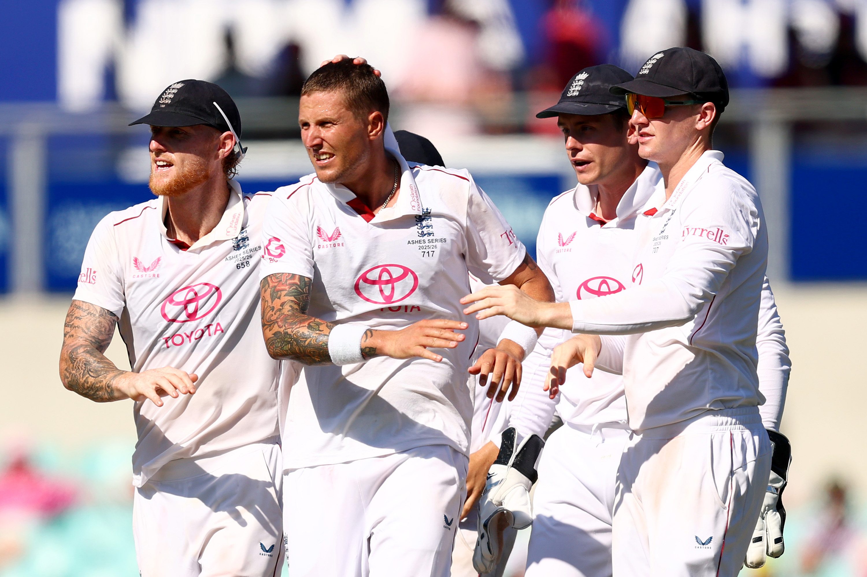 Brydon Carse of England is congratulated by teammates after taking the wicket of Cameron Green of Australia during the Ashes Series.