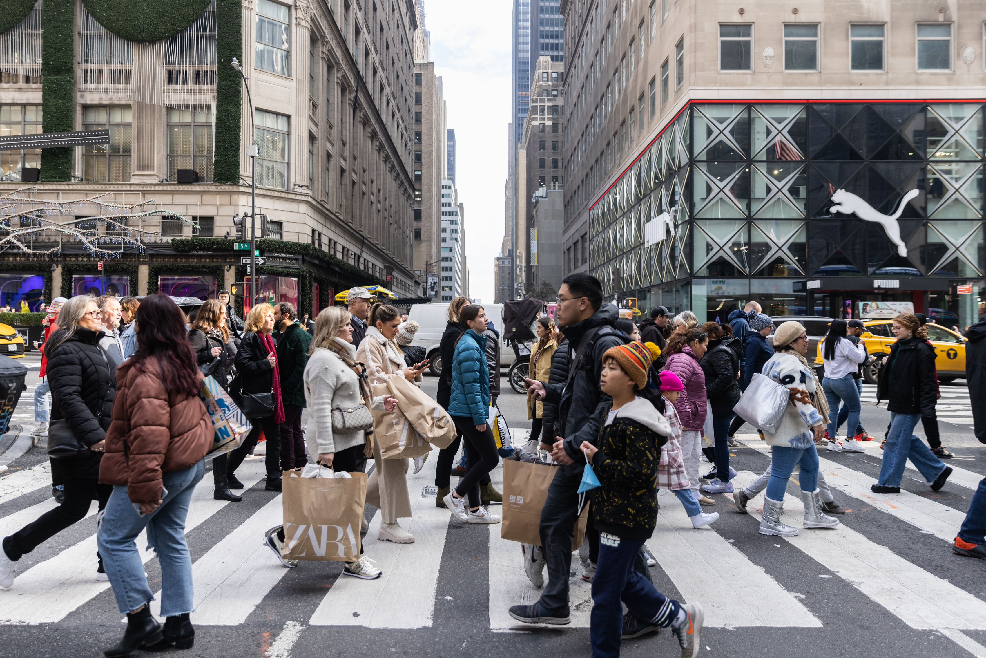 Shoppers cross 5th Avenue in Manhattan on Black Friday.