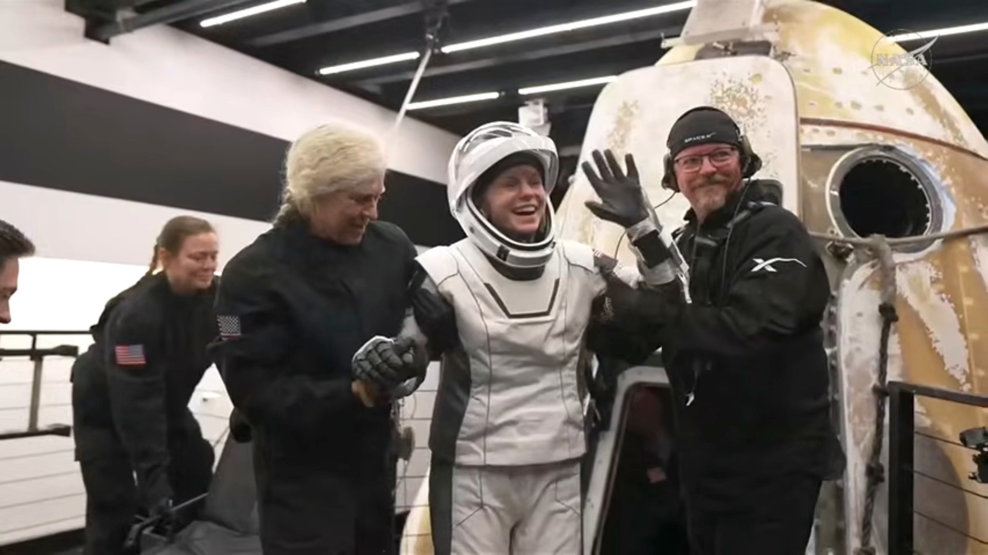 NASA astronaut Zena Cardman being helped out of the SpaceX Crew-11 capsule.