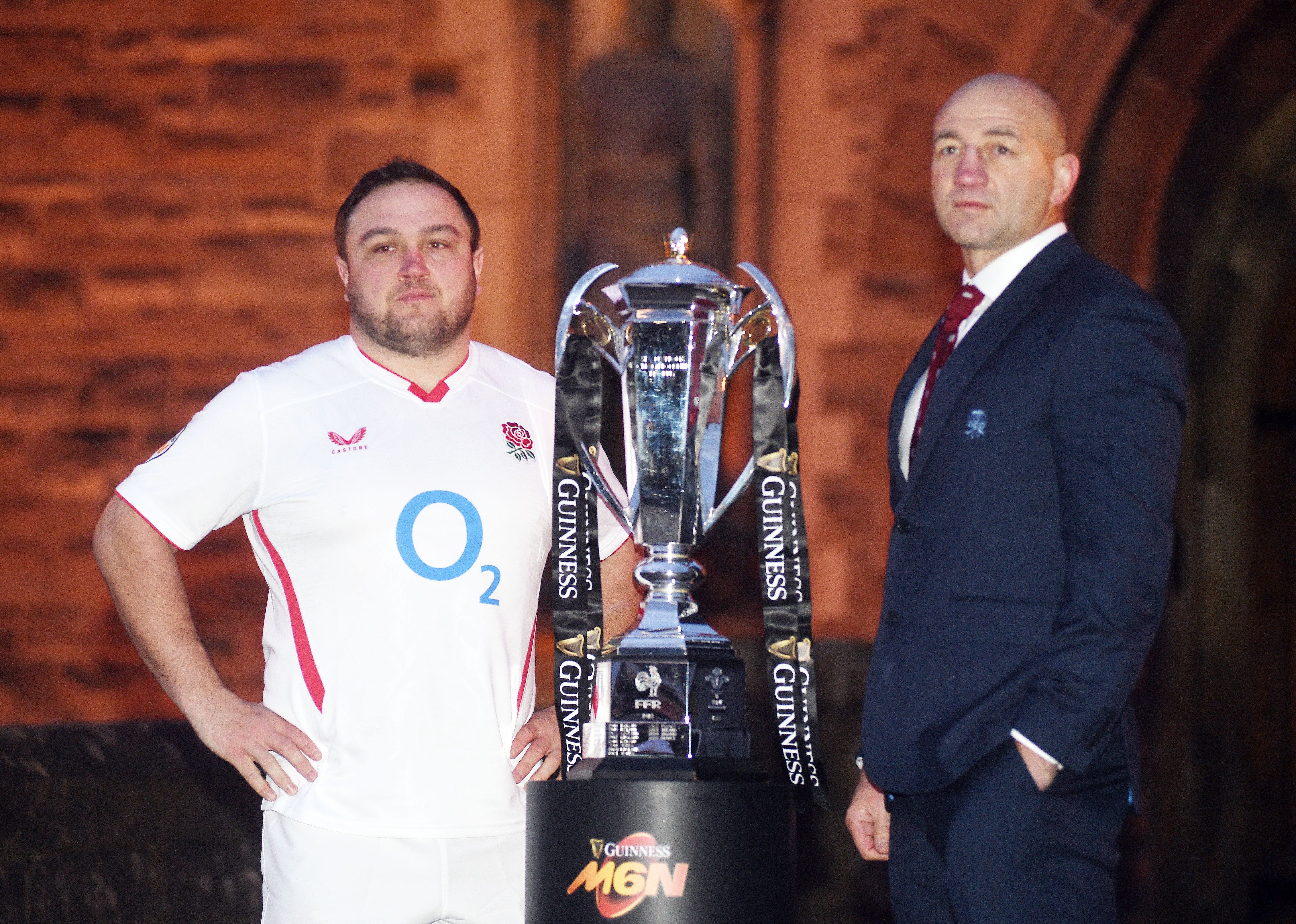 England co-captain Jamie George and head coach Steve Borthwick stand next to the Six Nations trophy.