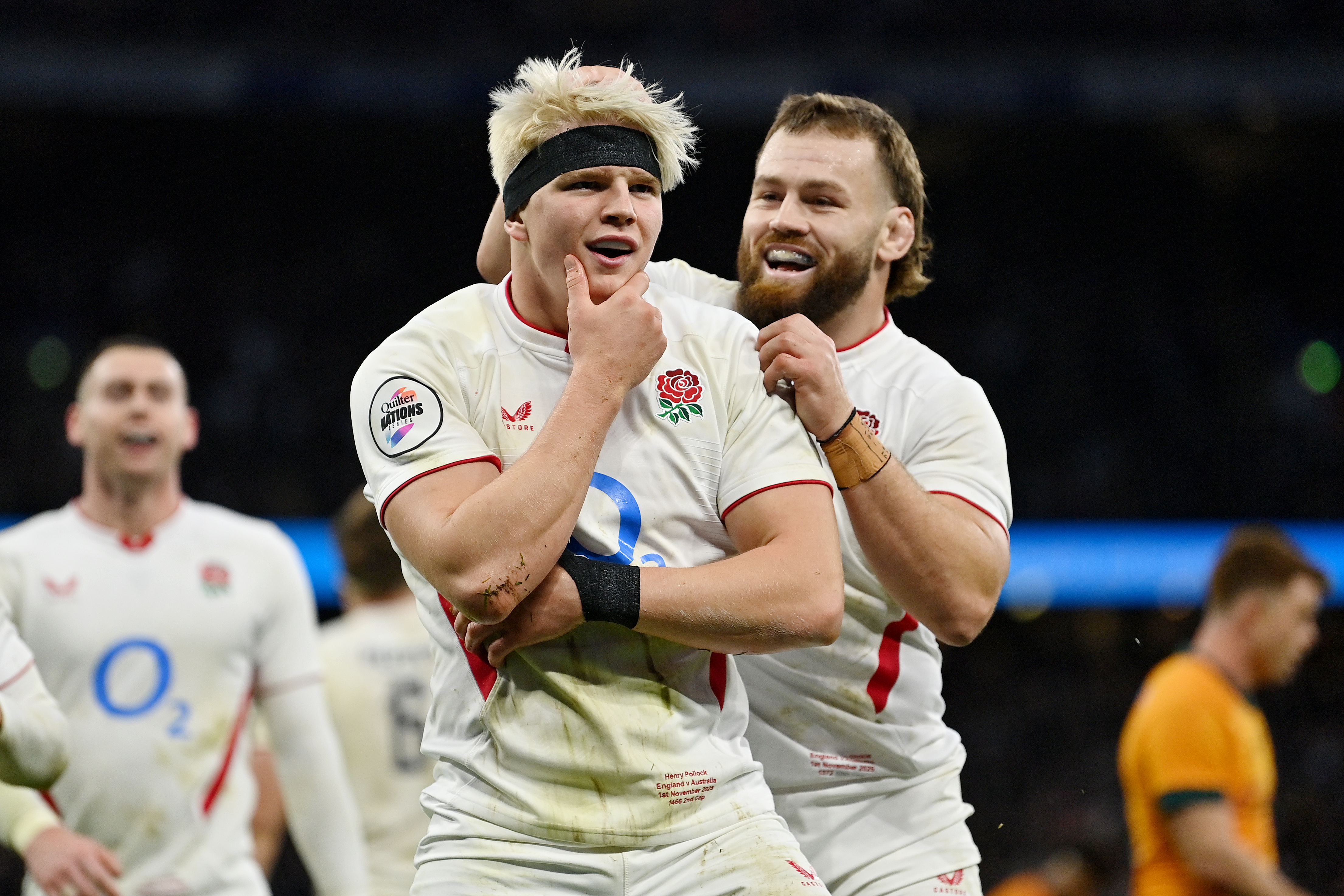 Henry Pollock of England celebrates scoring a try with teammate Luke Cowan-Dickie.