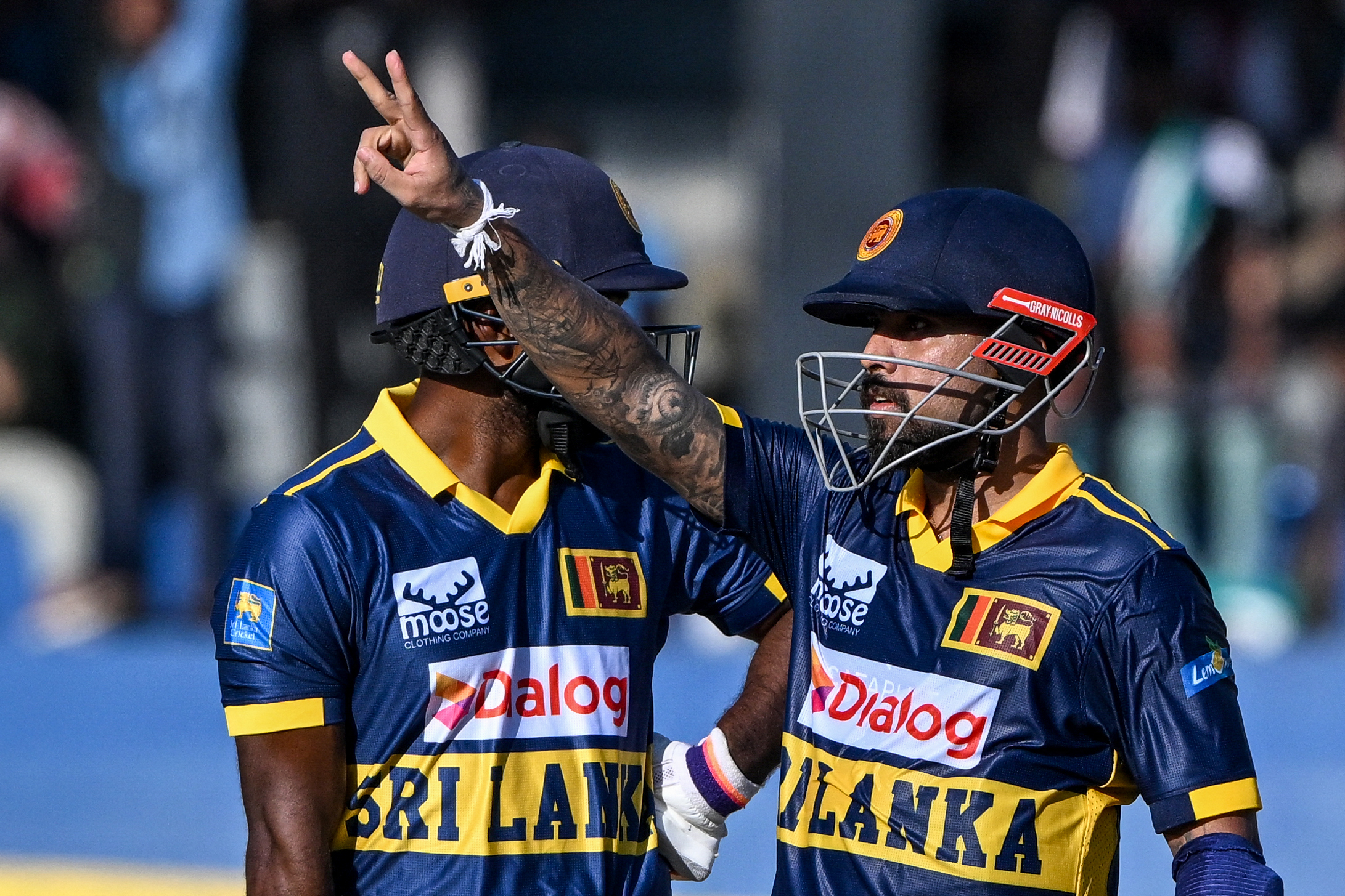 Sri Lanka's Kusal Mendis celebrates after scoring a half-century during an ODI cricket match against England.