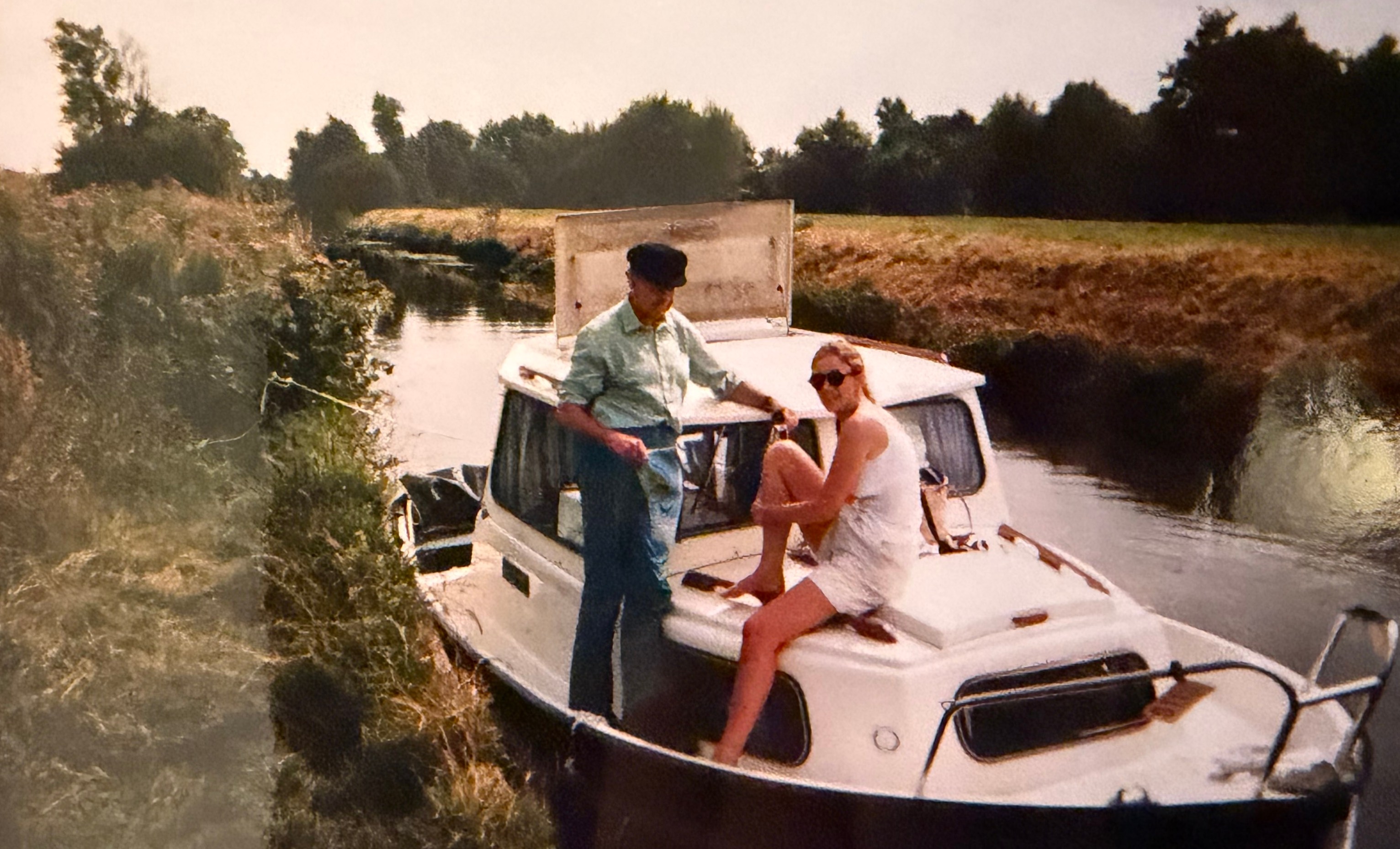 Alice Thomson with her father on a boat holiday.
