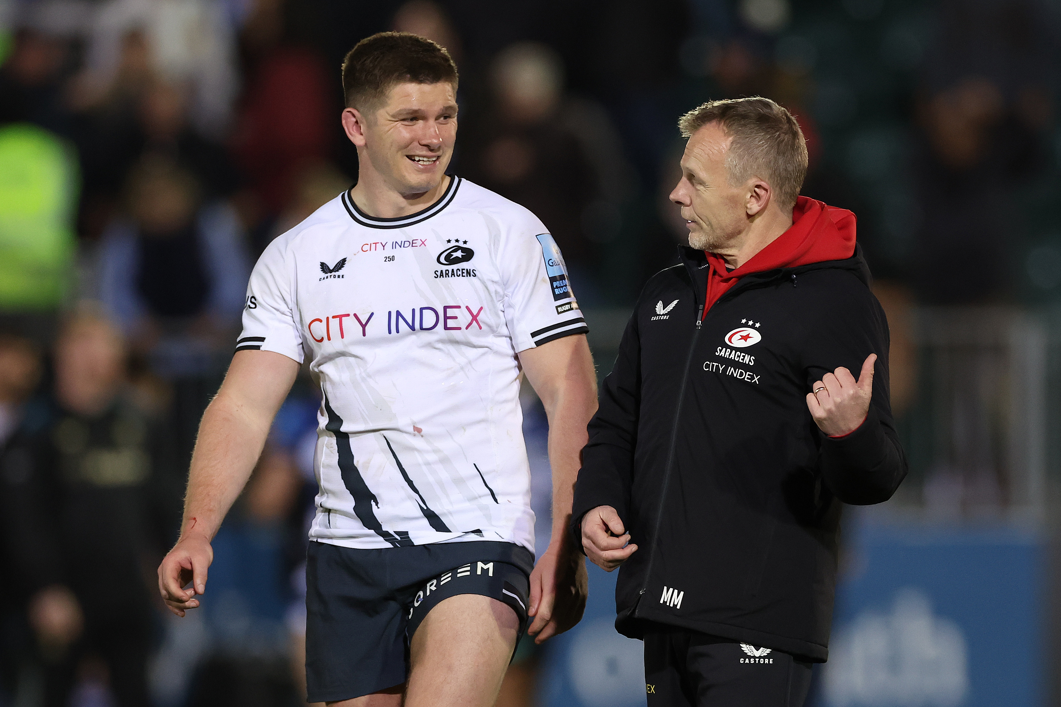 Owen Farrell and Mark McCall, the Saracens director of rugby, conversing after a Premiership Rugby match.