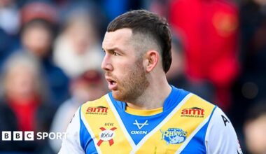 Cameron Smith with his head turned to the right playing for Leeds Rhinos in his own testimonial