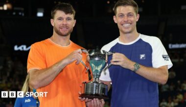 Christian Harrison and Neal Skupski hold the Australian Open men's doubles trophy