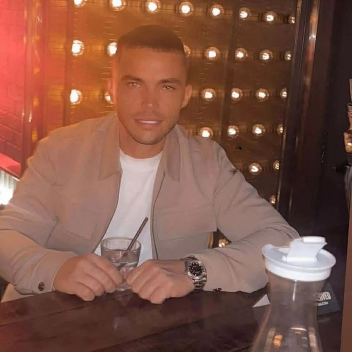 Dylan posing with a drink