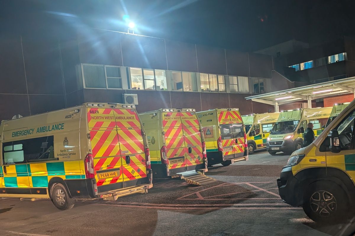 A queue of ambulances parked outside Arrowe Park Hospital on Thursday evening