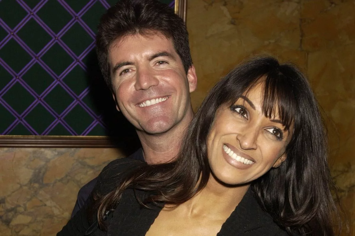 Man holds woman's waist