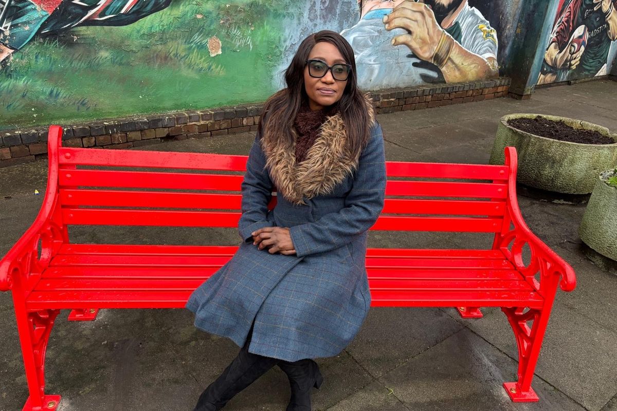 Dr Ighofose sitting on her bench
