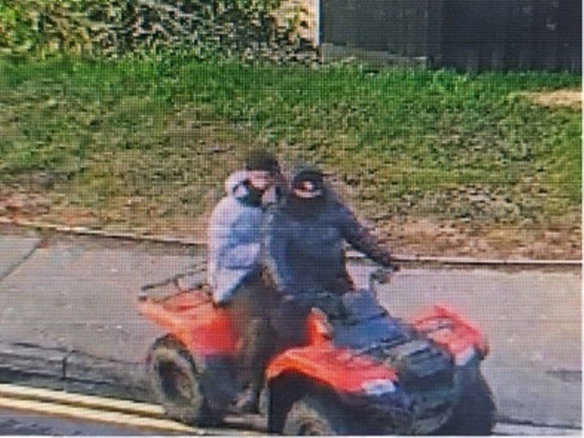 CCTV image of two people on red quad bike