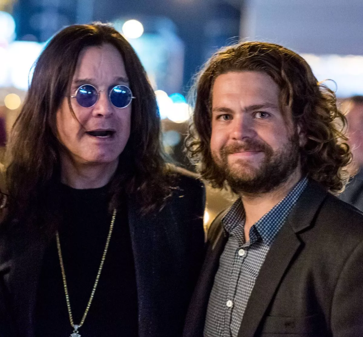 WEST HOLLYWOOD, CA - OCTOBER 29:  (L-R) Singer Ozzy Osbourne and Jack Osbourne pose for a pitcture with a fan at the Gallery Opening Of "Social Distortion: A Capsule Collection Of Fine Art By Billy Morrison" at Art On Scene on October 29, 2016 in West Hollywood, California.  (Photo by Greg Doherty/Getty Images)