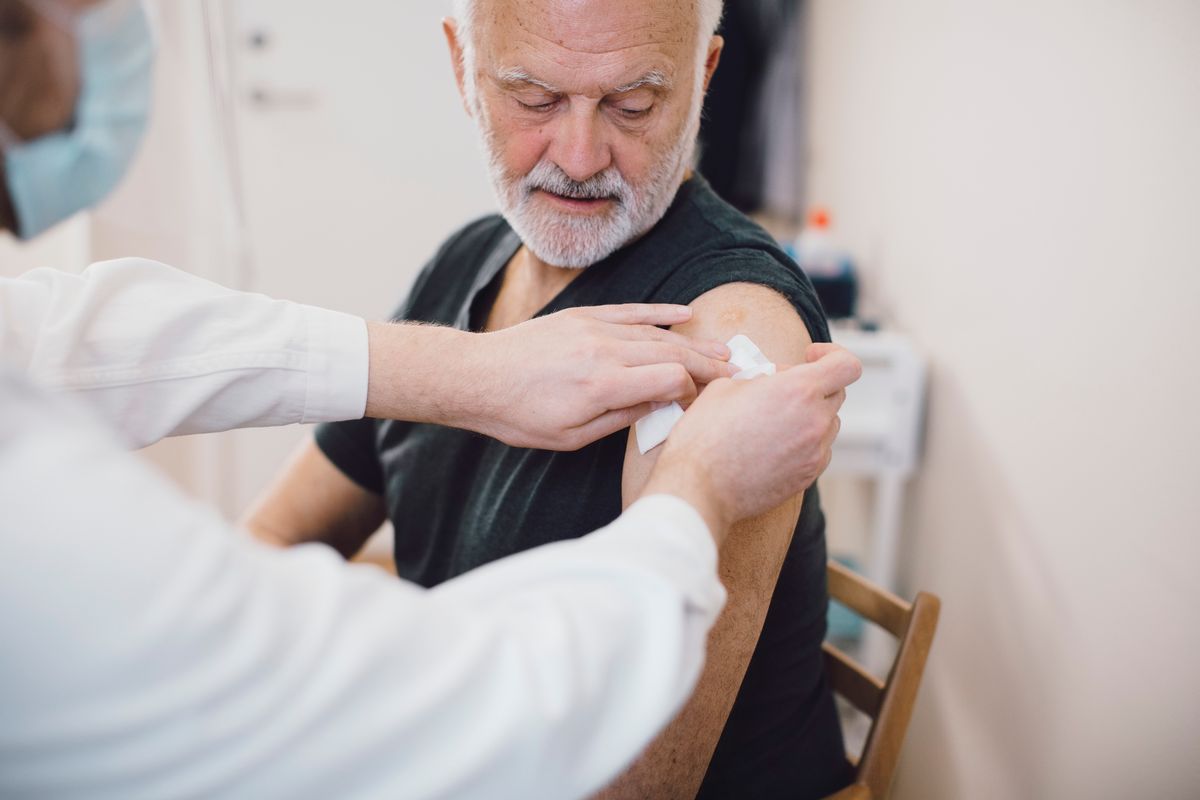 Older man receiving vaccine