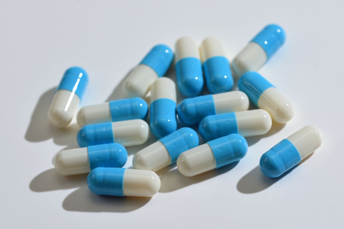 Film Coated Tablets 20mg  Omeprazole capsules blue and white grouped on white background