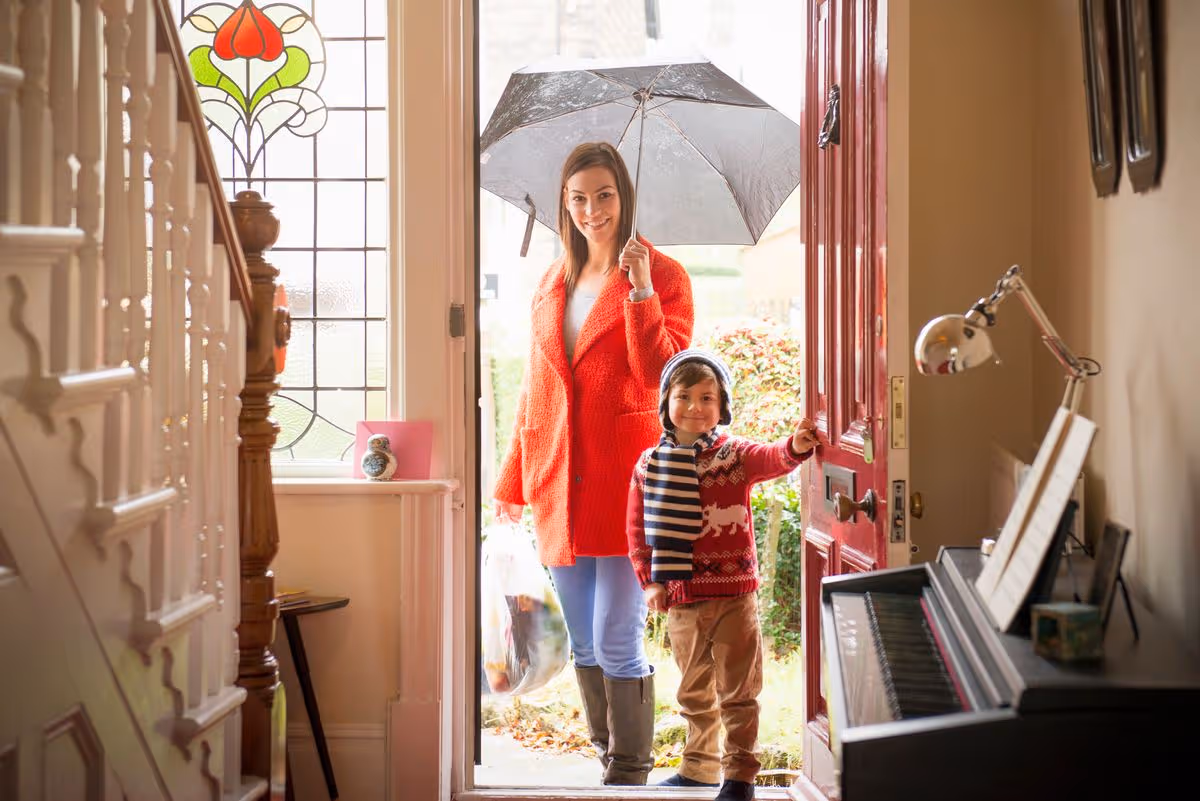 Family going outside in the rain