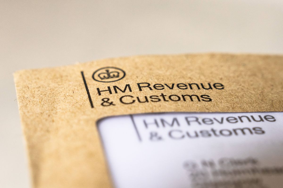 London, UK - Macro image of a tax letter in an envelope from HM Revenue and Customs.