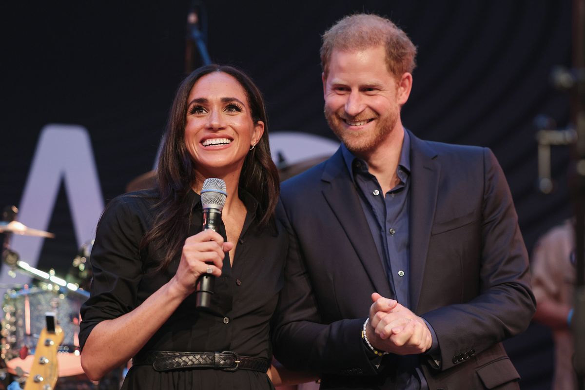 Harry with wife Meghan 