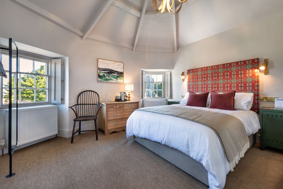 The pub now has five stunning ensuite bedrooms with actor Matthew Rhys one of the first to stay at The renovation, conversion and transformation of T'yn Llan commnity pub in Llandwrog, Gwynedd this is the new build extension with restaurant, catering kitchen, facilities and community room 