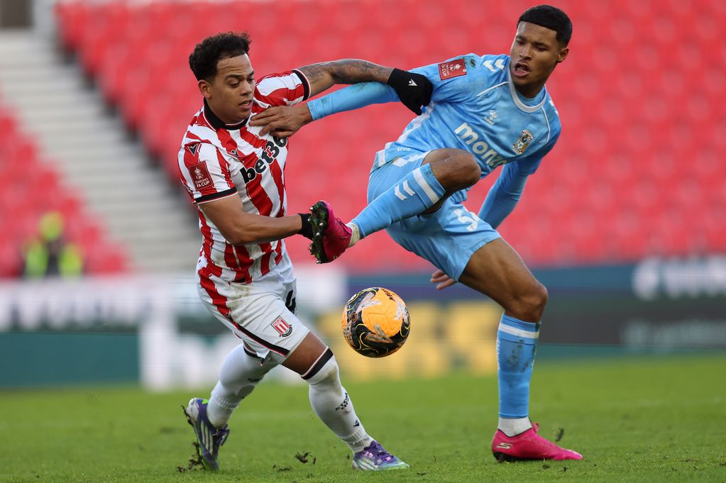 Million Manhoef of Stoke City battles for possession with Kai Andrews of Coventry City
