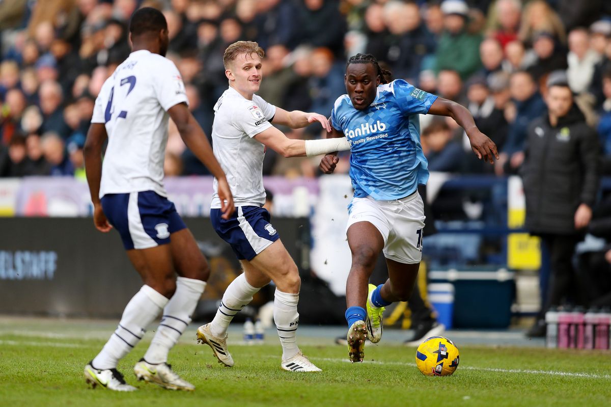 David Ozoh of Derby County is challenged by Ali McCann of Preston North End during the Sky Bet Championship match between Preston North End and Derby County at Deepdale