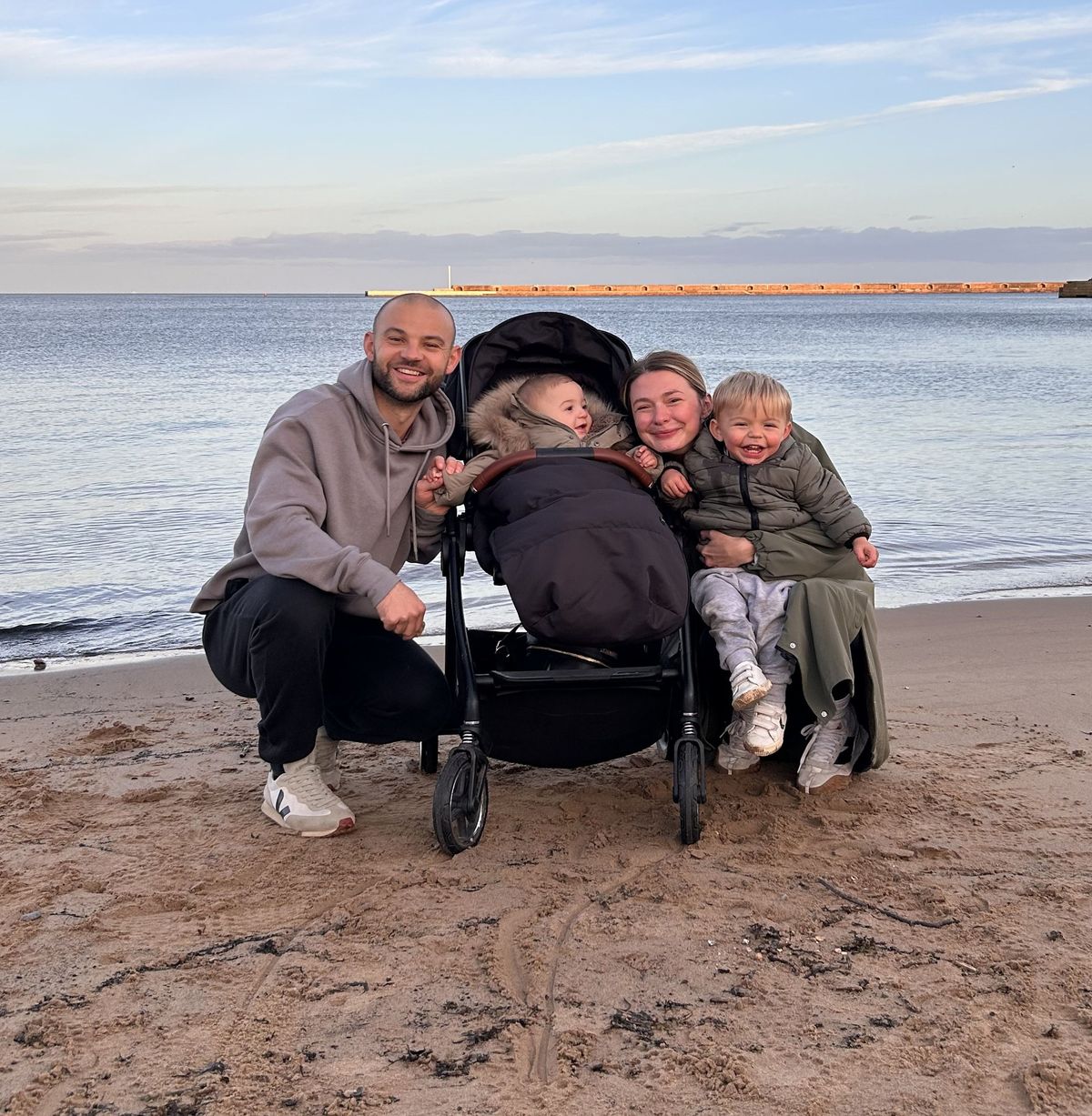 Hollie with husband Harry and children Oliver and Jack