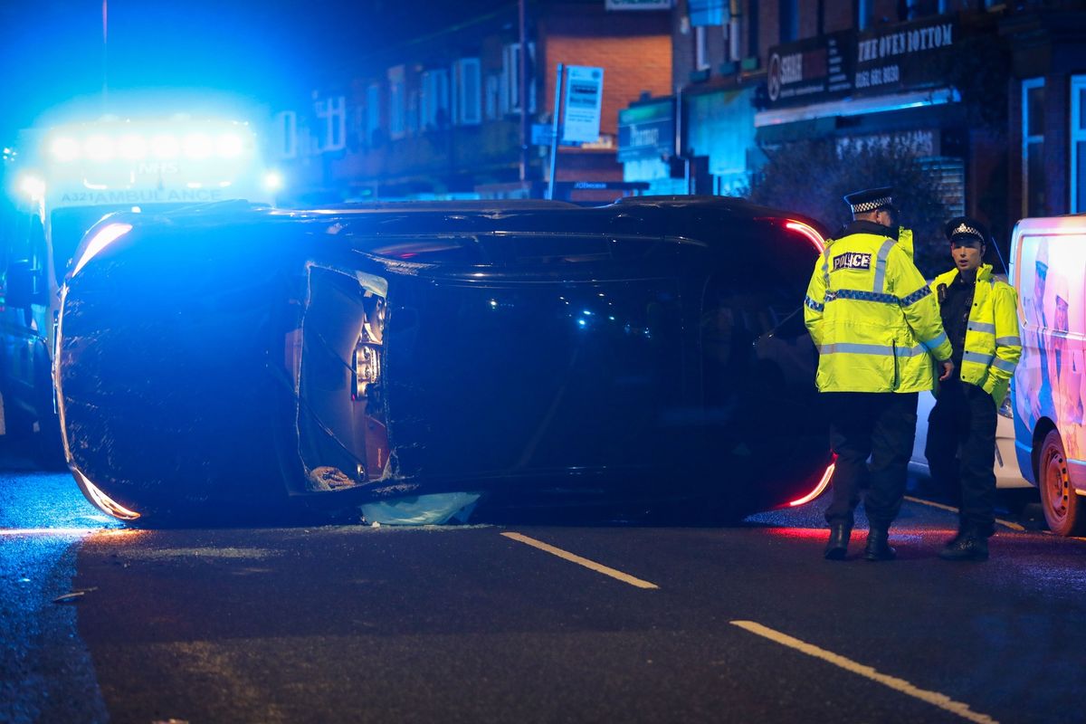 A car had rolled on its side following the collision on Lightbowne Road, Moston
