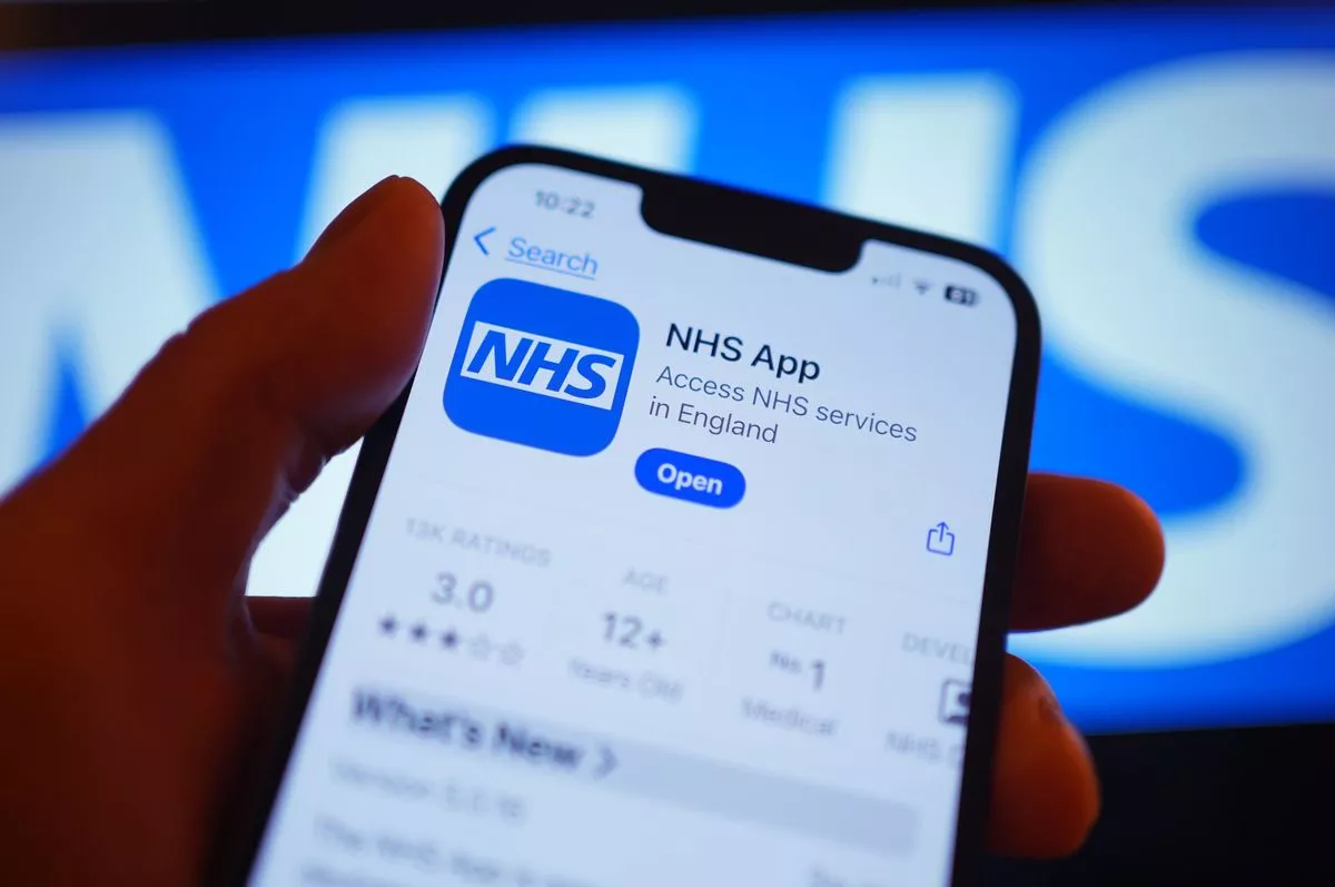a person viewing the NHS app on a mobile phone.