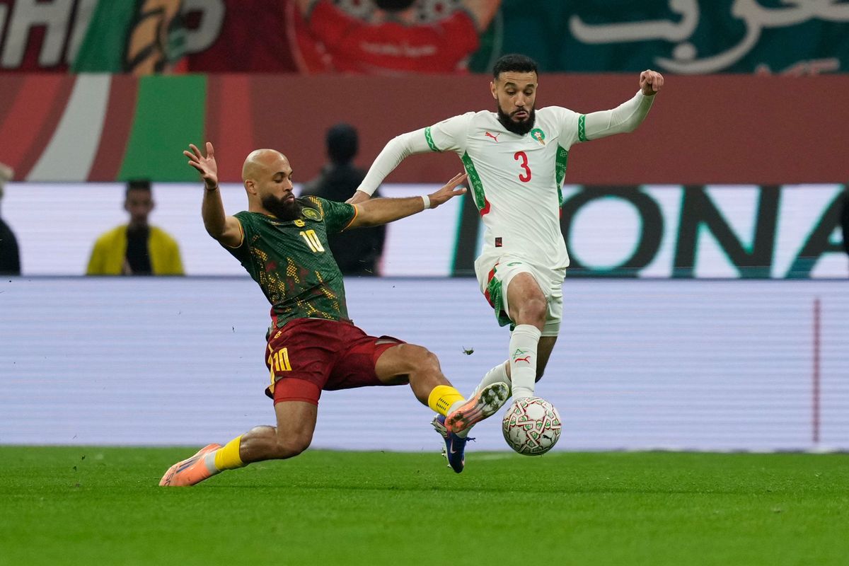 Noussair Mazraoui is challenged by Bryan Mbeumo during the Africa Cup of Nations quarterfinal match between Cameroon and Morocco. 