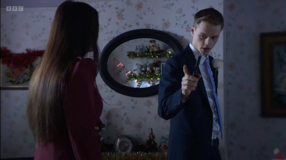 Which child does Max Branning love more - that's what one mystery gun-toting figure wants to know