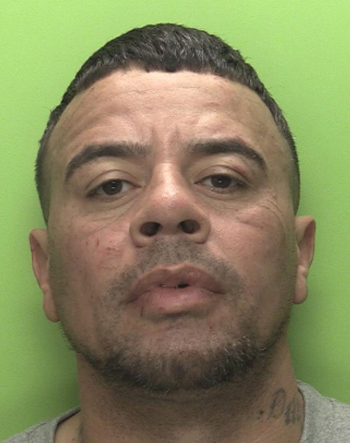 The police custody photo of Simon McHugh