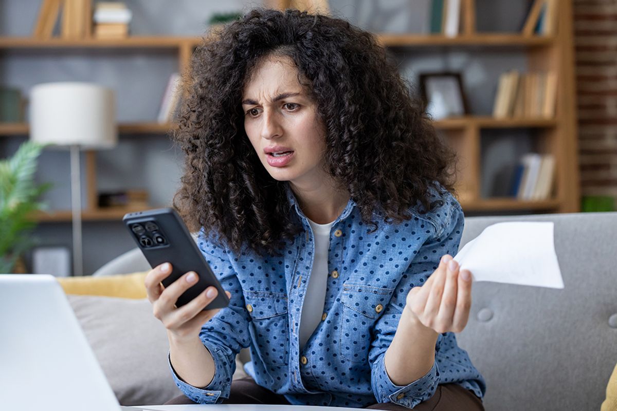 A woman checks her finances