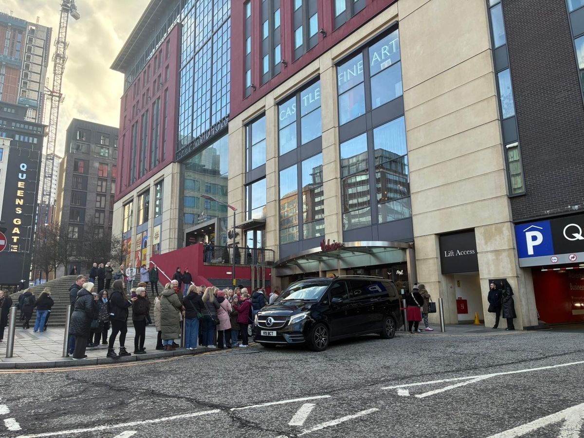 Crowds gather outside The Mailbox on the morning of January 24