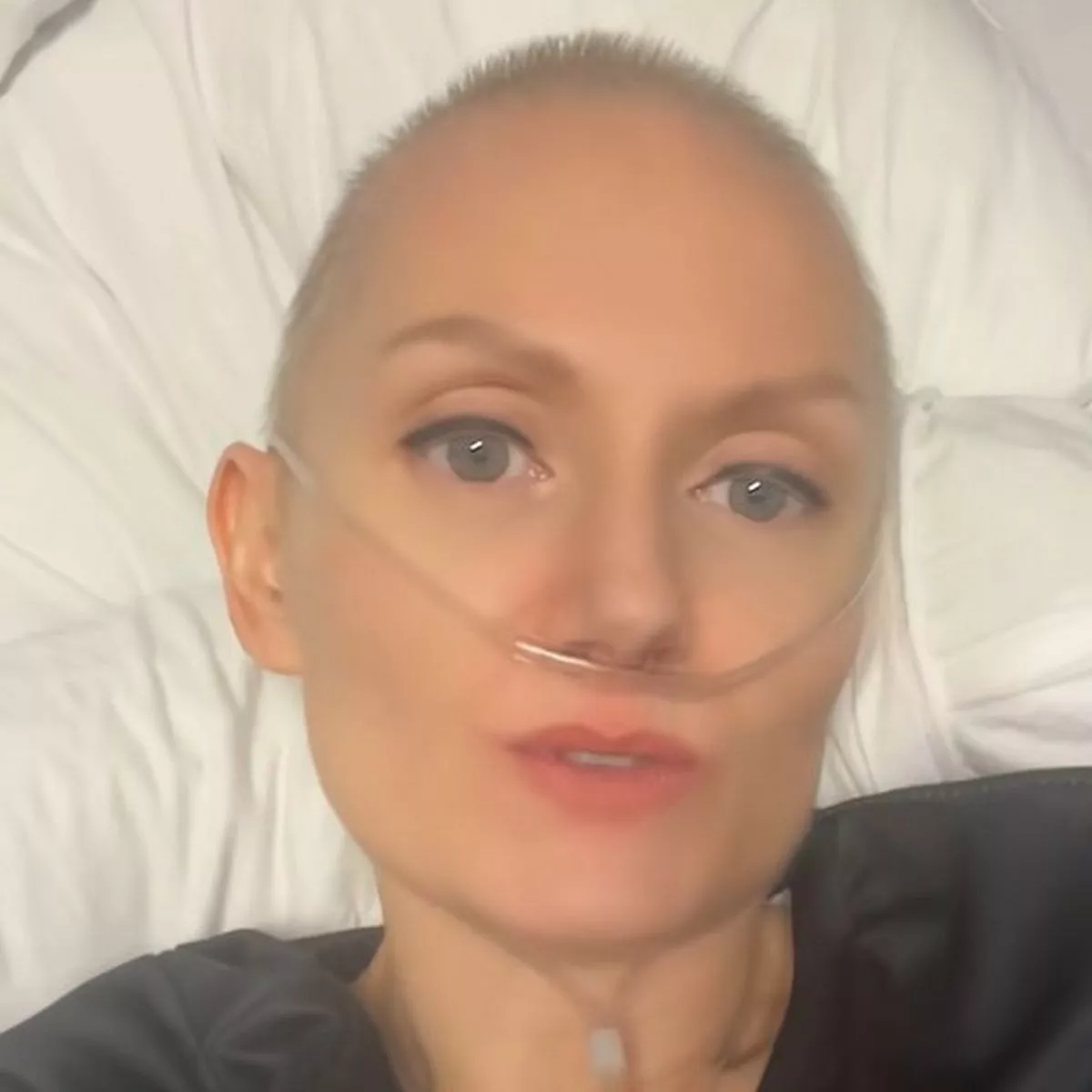 Michelle lying in hospital bed