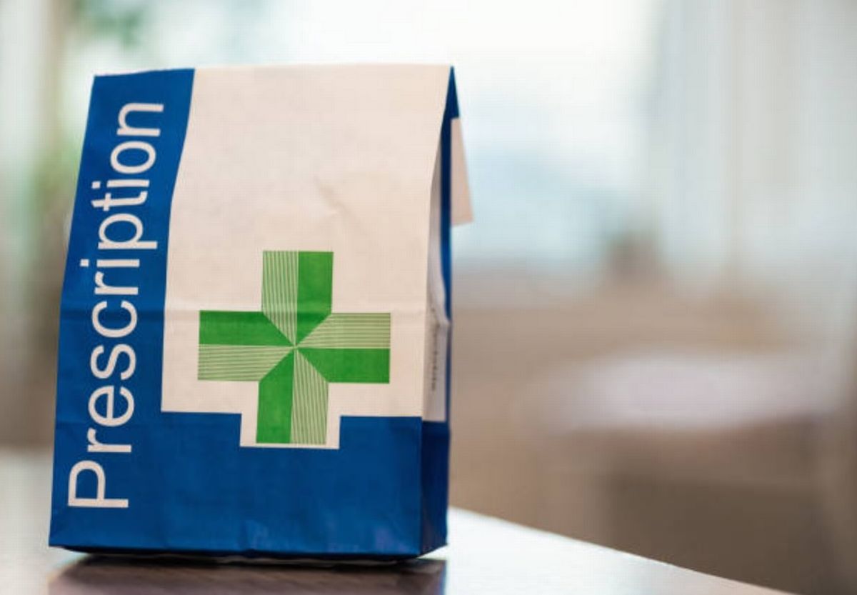 A prescription bag on a table