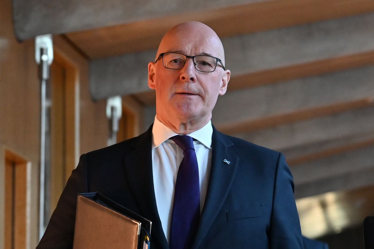 First Minister John Swinney on the way to First Minister's Questions in the Scottish Parliament