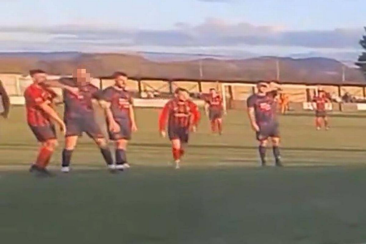 A Trearddur Bay player elbows a Porthmadog player