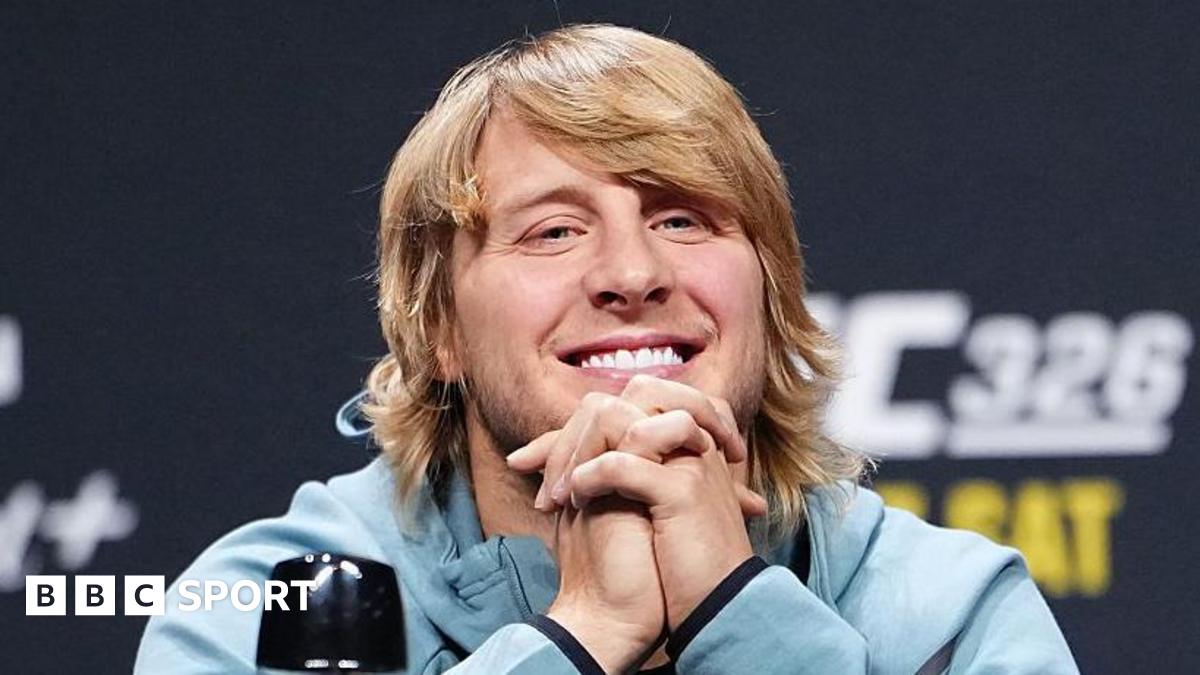 Paddy Pimblett grins during a news conference