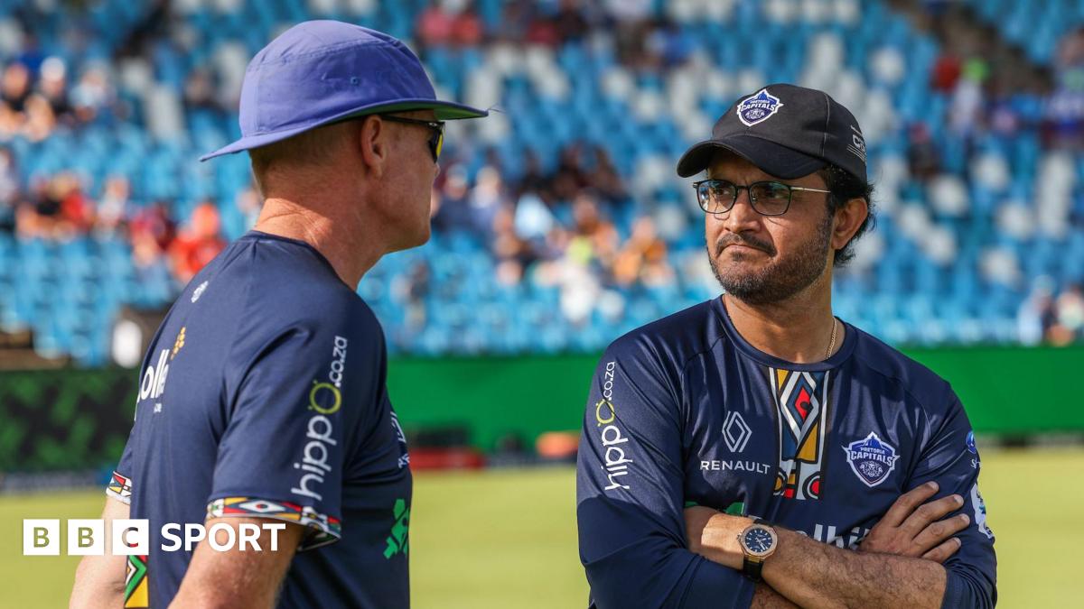 Shaun Pollock and Sourav Ganguly of Pretoria Capitals chat before a game