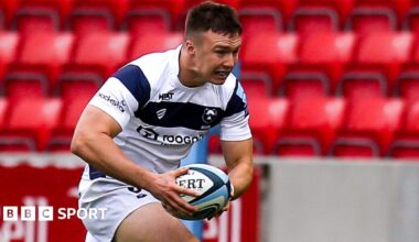Charlie Powell running with the ball