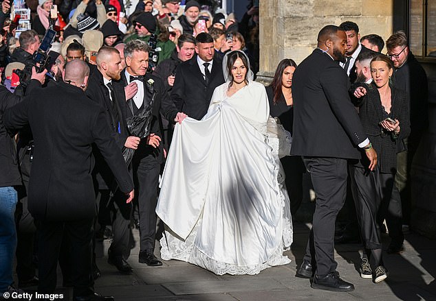 The bride’s arrival at the church was chaotic, hampered by a phalanx of security guards whose presence lent the occasion all the sophistication of Wetherspoon at chucking-out time