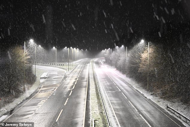 Snow falls on the A41 near Tring in Hertfordshire in the early hours of Friday morning