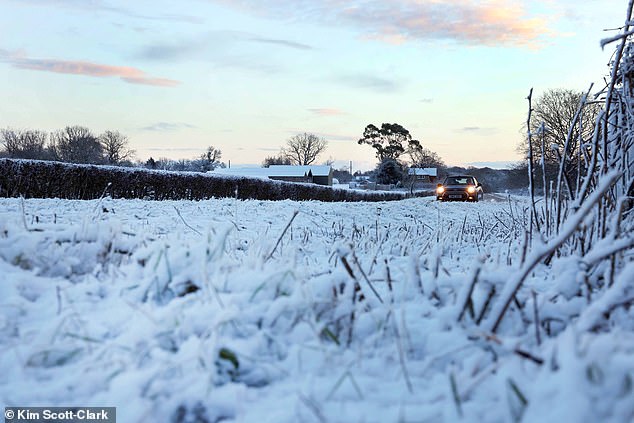 Snow in the village of Tatsfield in Surrey on Friday morning as weather warnings were imposed