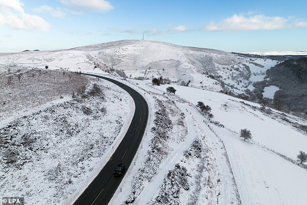 Snow on the ground surrounding the Horseshoe Pass in Denbighshire, North Wales