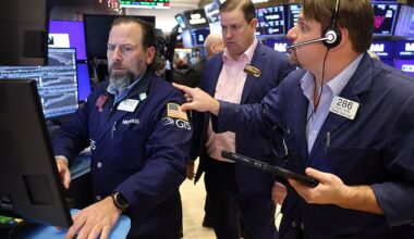Traders work on the floor of the New York Stock Exchange as fresh data showed U.S job growth slowed in December, fueling fears the economy may be losing momentum