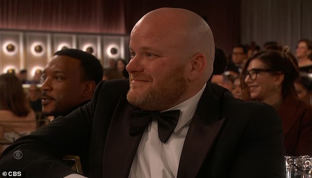 Owen's proud dad Andy was also beaming as he watched on