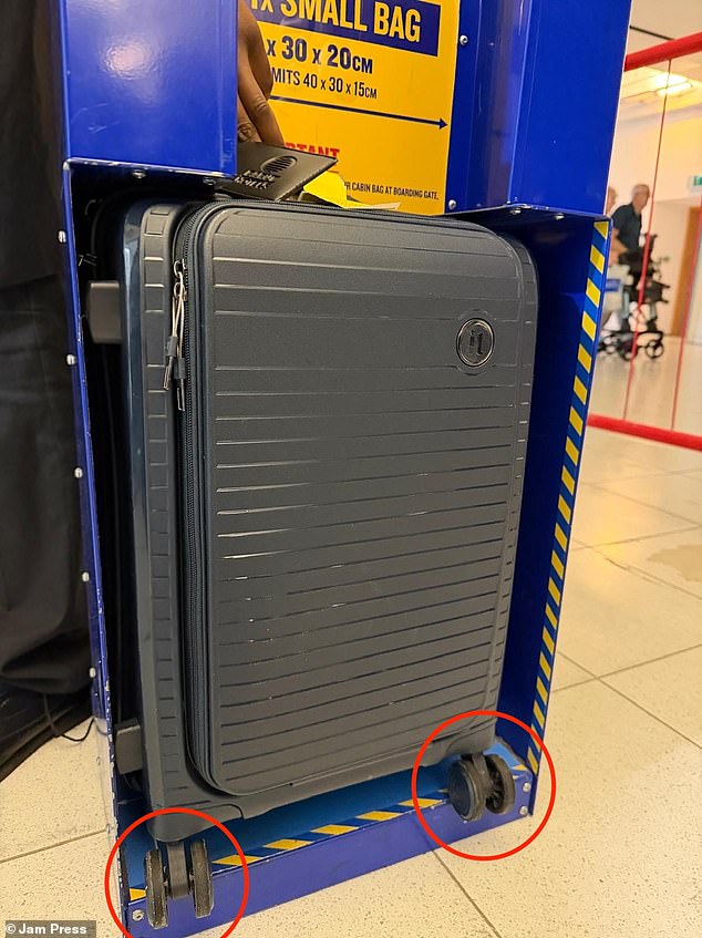 The wheels on Gilly's suitcase were poking out of the airline's bag sizer
