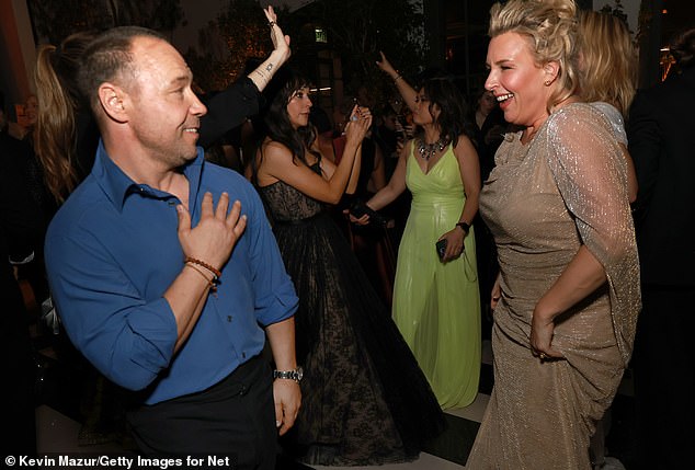 The couple, who have been married for 17 years, were spotted dancing the night away at the Golden Globes Netflix afterparty where he was joined by his co-stars