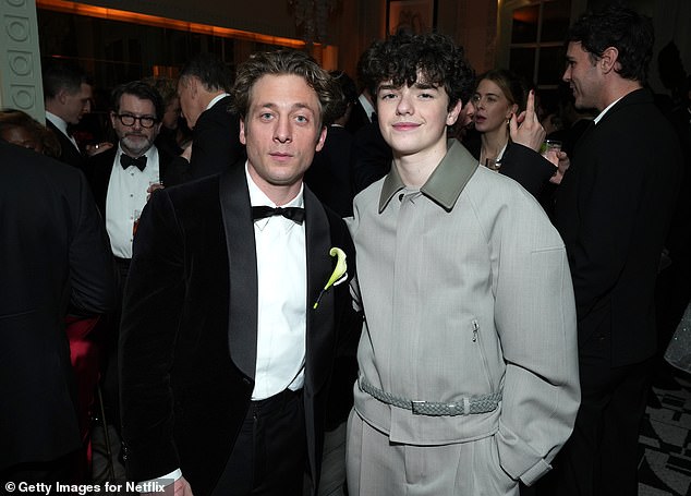 The group were pictured mingling with fellow big name actors, including Owen who posed for a snap with Jeremy Allen White (left) inside the bash.