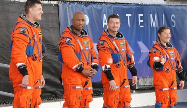 (From left to right) Astronauts Jeremy Hansen, Victor Glover, Reid Wiseman, and Christina Koch pose in their flight suits for the Artemis II mission, scheduled for February 2026