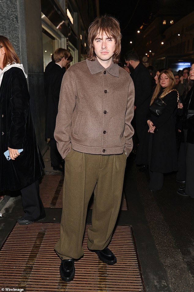 Lennon's brother Gene cut a trendy figure in a brown and khaki ensemble